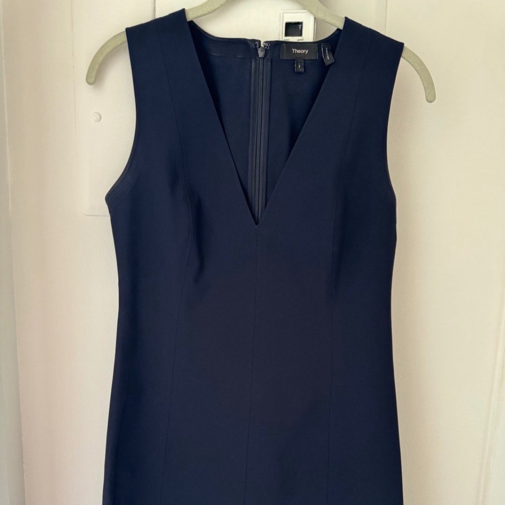 Elevate your wardrobe with this timeless Theory black sleeveless dress.
